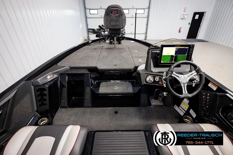 Slide: The Image of 2023 Ranger Z519 boat interior with steering wheel and navigation display. - 13