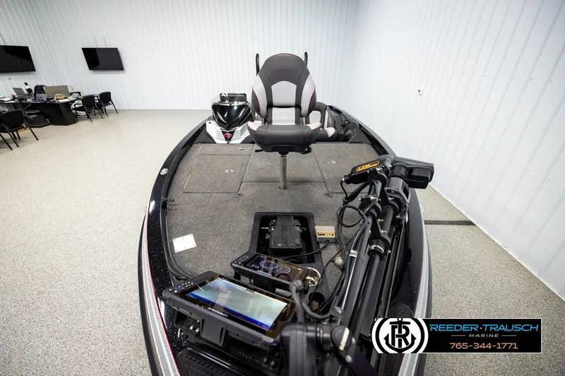 Slide: The Image of 2023 Ranger Z519 boat interior with advanced navigation equipment in showroom. - 15