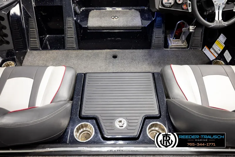 Slide: The Image of 2023 Ranger Z519 boat interior with dual seats and central storage compartment. - 19