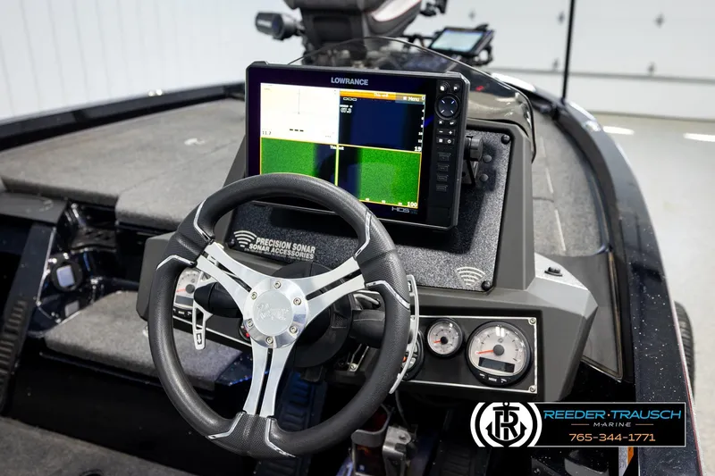 Slide: The Image of 2023 Ranger Z519 boat dashboard with sonar display and steering wheel. - 25