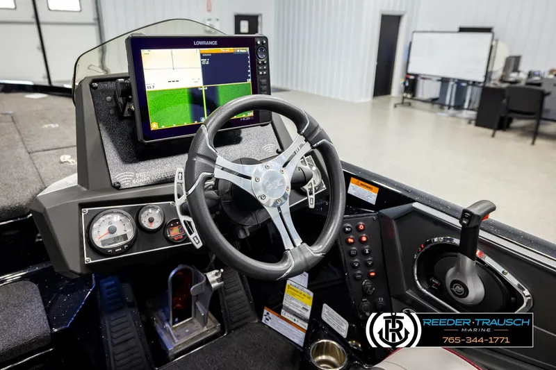Slide: The Image of 2023 Ranger Z519 boat dashboard with steering wheel and Lowrance display. - 26