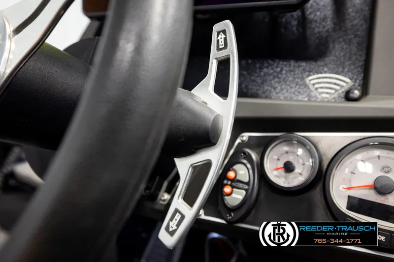 Slide: The Image of Close-up of 2023 Ranger Z519 boat dashboard with steering wheel and gauges. - 31