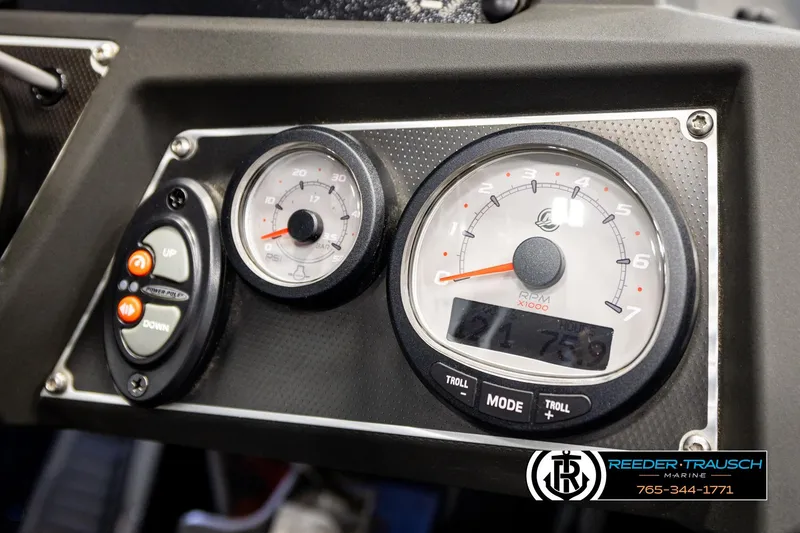 Slide: The Image of Dashboard of 2023 Ranger Z519 boat with RPM and PSI gauges, Reeder-Trausch Marine branding. - 32