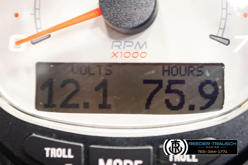 Slide: The Image of Close-up of a 2023 Ranger Z519 gauge showing 12.1 volts and 75.9 hours. - 33