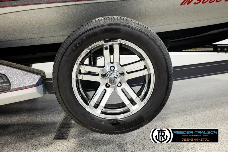 Slide: The Image of 2023 Ranger Z519 boat trailer wheel with chrome rim and Load Star tire. - 52