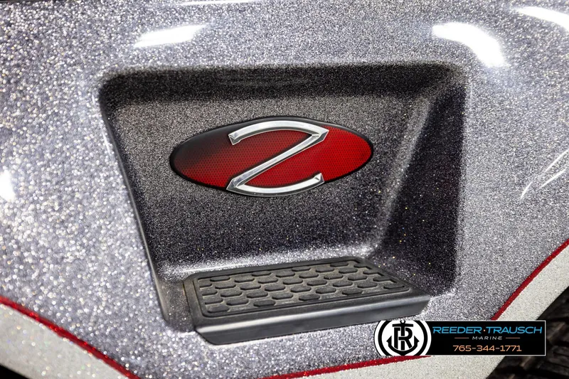 Slide: The Image of 2023 Ranger Z519 boat detail with metallic finish and logo, Reeder-Trausch Marine branding. - 54