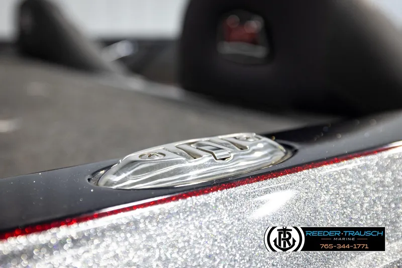 Slide: The Image of 2023 Ranger Z519 boat detail with metallic finish and Reeder-Trausch Marine logo. - 55