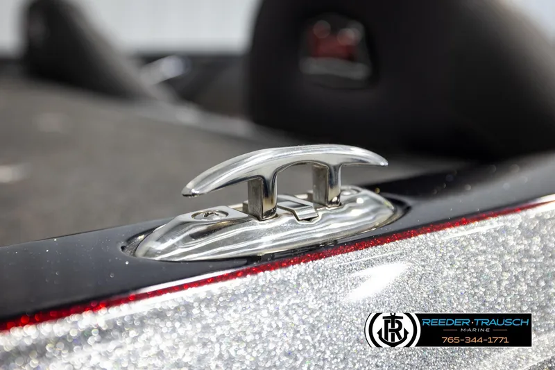 Slide: The Image of 2023 Ranger Z519 boat cleat detail with metallic finish, Reeder-Trausch Marine logo visible. - 56