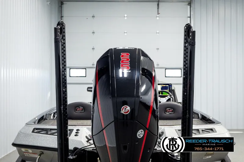 Slide: The Image of 2023 Ranger Z519 boat in a garage, featuring a powerful engine and sleek design. - 6