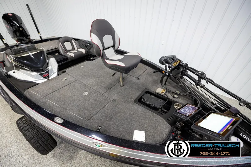 Slide: The Image of 2023 Ranger Z519 fishing boat interior with seating and advanced navigation equipment. - 8
