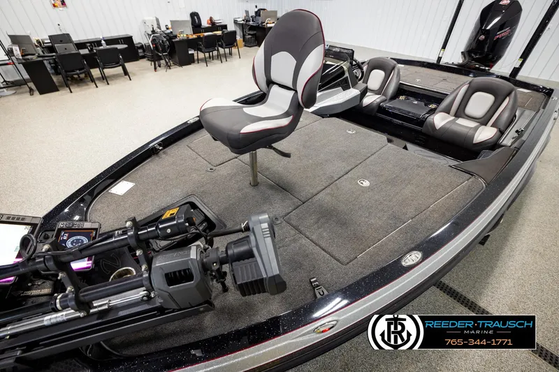 Slide: The Image of 2023 Ranger Z519 fishing boat interior with seating and equipment, displayed at Reeder-Trausch Marine. - 9
