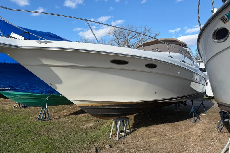 The Image of 1997 Sea Ray Sundancer 330 boat on stands, ready for maintenance. - 0