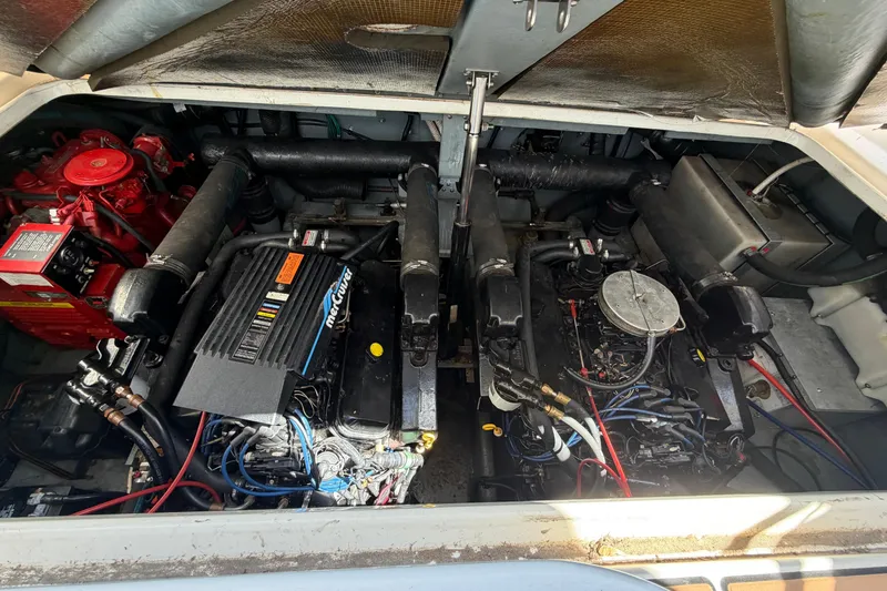 Slide: The Image of Engine compartment of a 1997 Sea Ray Sundancer 330, featuring dual MerCruiser engines. - 16