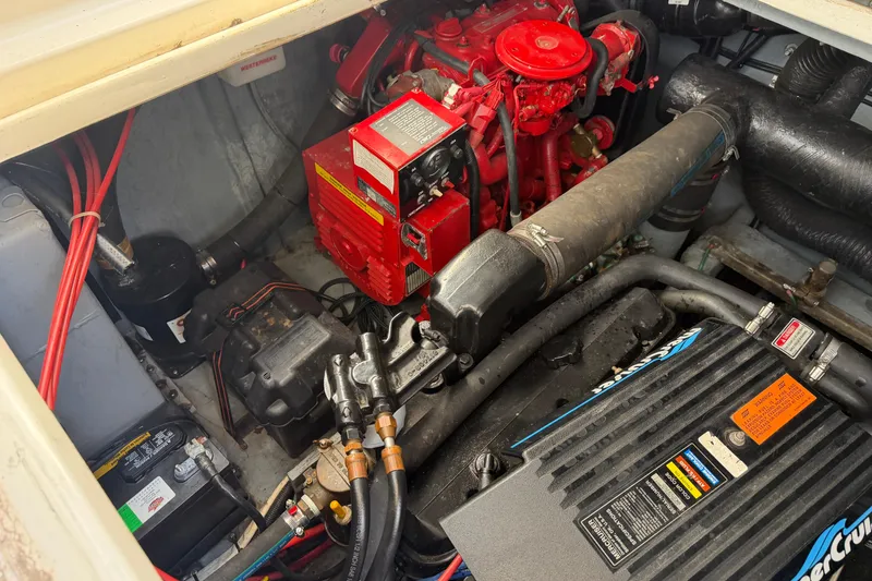 Slide: The Image of Engine compartment of a 1997 Sea Ray Sundancer 330, featuring detailed mechanical components. - 17