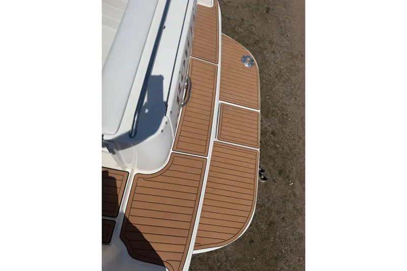 Slide: The Image of 1997 Sea Ray Sundancer 330 swim platform with teak-style decking, viewed from above. - 3