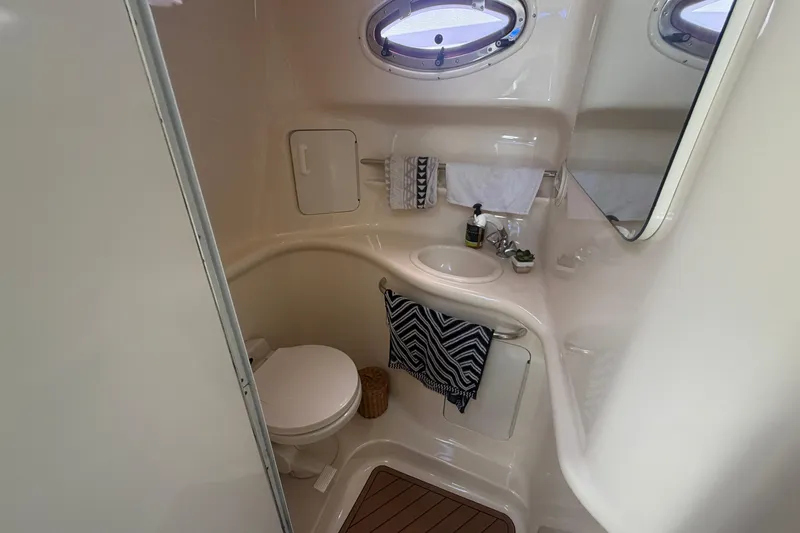 Slide: The Image of Bathroom interior of 1997 Sea Ray Sundancer 330 yacht, featuring sink and toilet. - 9