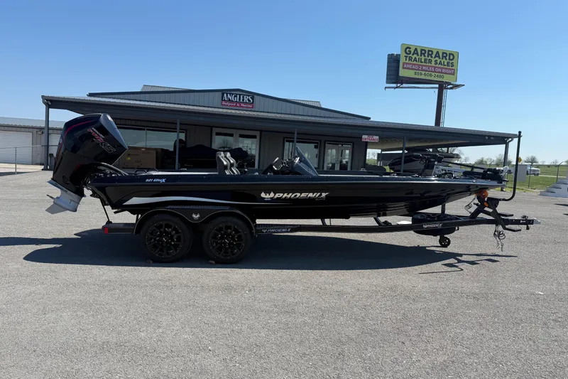 The Image of 2026 Phoenix 921 Elite X boat parked at Anglers Outpost & Marine dealership. - 1