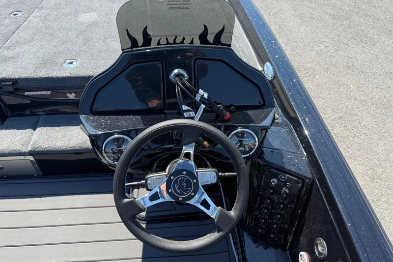 Slide: The Image of Steering console of 2026 Phoenix 921 Elite X boat with modern controls and dashboard. - 13