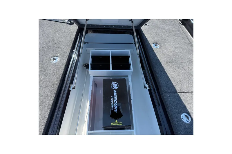 Slide: The Image of Open storage compartment in 2026 Phoenix 921 Elite X boat, featuring organized interior space. - 17