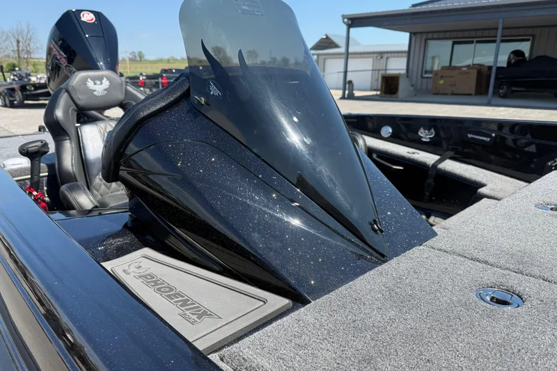 Slide: The Image of 2026 Phoenix 921 Elite X boat with sleek black design and comfortable seating. - 6