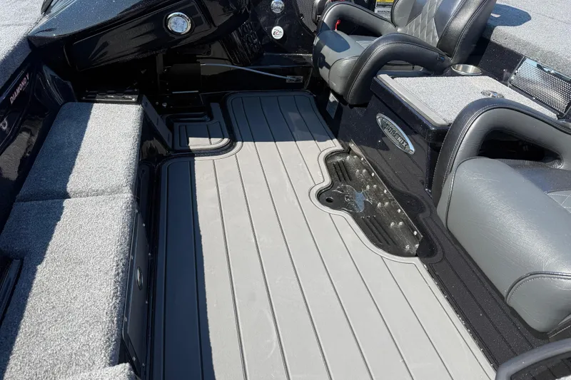 Slide: The Image of Interior of 2026 Phoenix 921 Elite X boat with gray seating and flooring. - 9