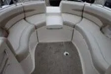 Slide: The Image of 2002 Chaparral Sunesta 263 boat interior with curved seating arrangement. - 14