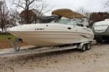 Slide: The Image of 2002 Chaparral Sunesta 263 boat on trailer, parked outdoors. - 3