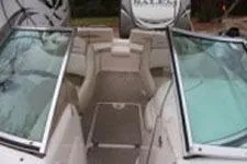 Slide: The Image of 2002 Chaparral Sunesta 263 boat interior with open seating and glass windshields. - 6
