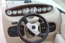 Slide: The Image of 2002 Chaparral Sunesta 263 dashboard with steering wheel and instrument panel. - 8