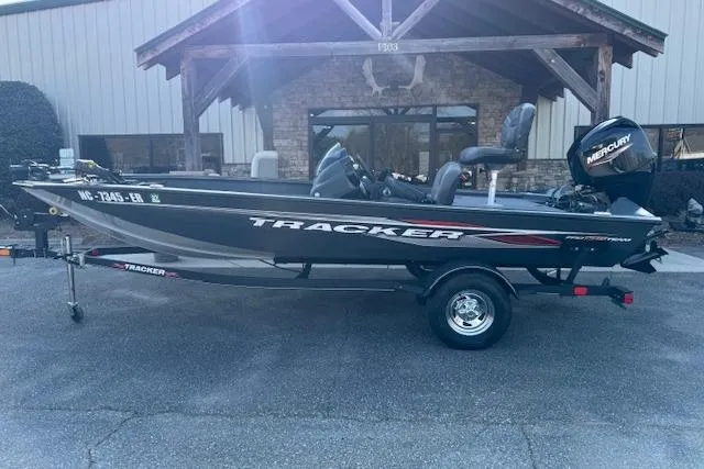 The Image of 2021 Tracker Pro Team 175 Crappie Edition boat with Mercury engine, parked outdoors. - 1