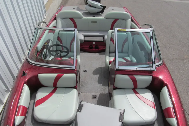Slide: The Image of 2000 Triton SF-21 boat interior with red and white seating, dual windshields, and steering wheel. - 12