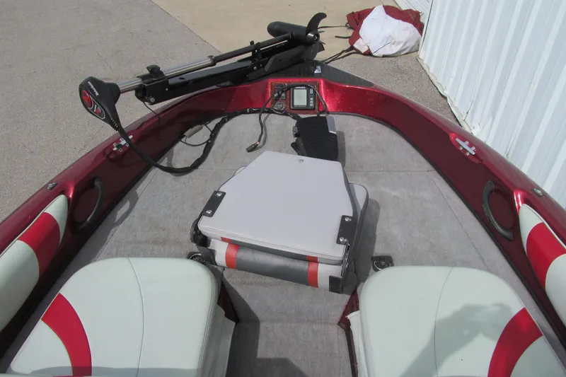 Slide: The Image of 2000 Triton SF-21 boat interior with red accents and fishing equipment. - 9