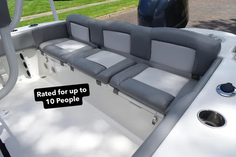 Slide: The Image of 2022 NauticStar 2302 Legacy boat seating, rated for up to 10 people. - 11