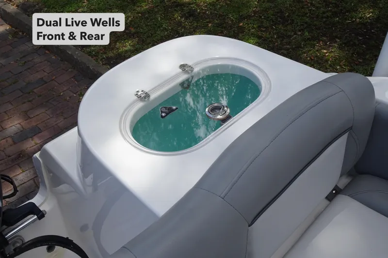 Slide: The Image of 2022 NauticStar 2302 Legacy boat with dual live wells, front and rear. - 12