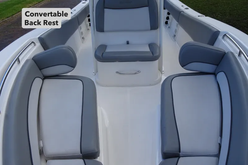 Slide: The Image of 2022 NauticStar 2302 Legacy boat interior with convertible backrest and cushioned seating. - 13