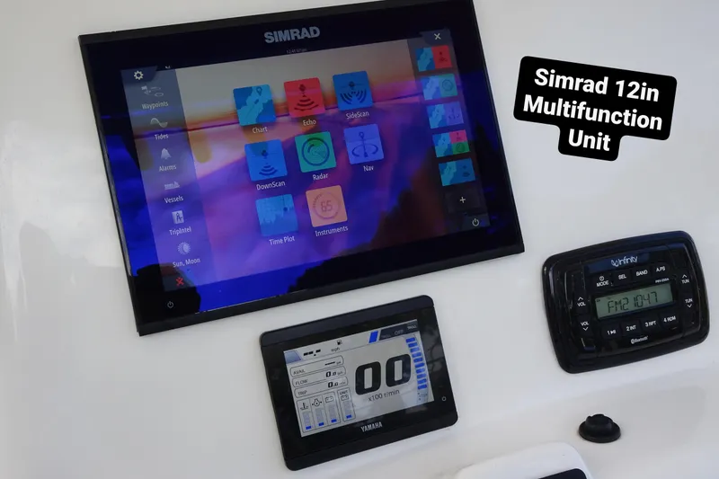 Slide: The Image of Simrad 12-inch multifunction unit on 2022 NauticStar 2302 Legacy boat dashboard. - 14