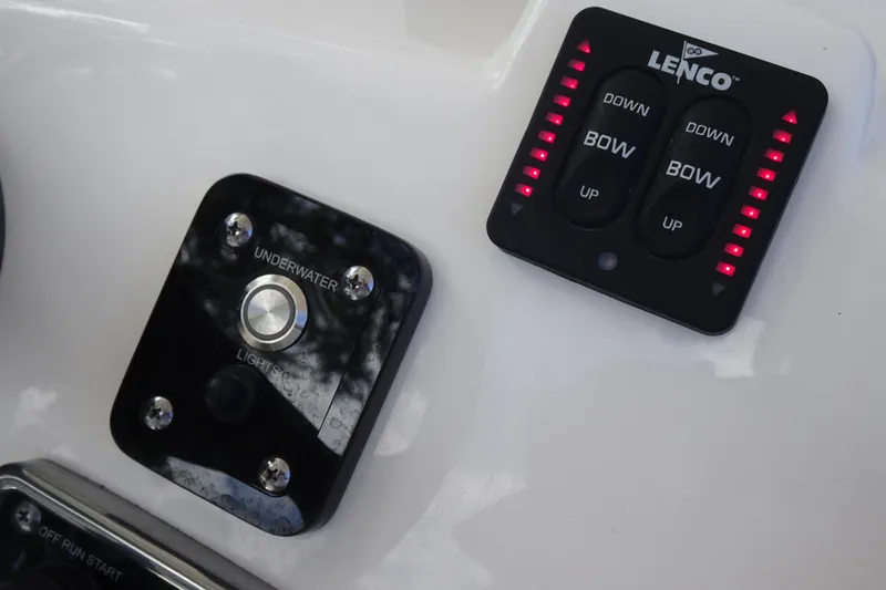 Slide: The Image of Control panel of 2022 NauticStar 2302 Legacy boat with Lenco trim tab switches. - 17