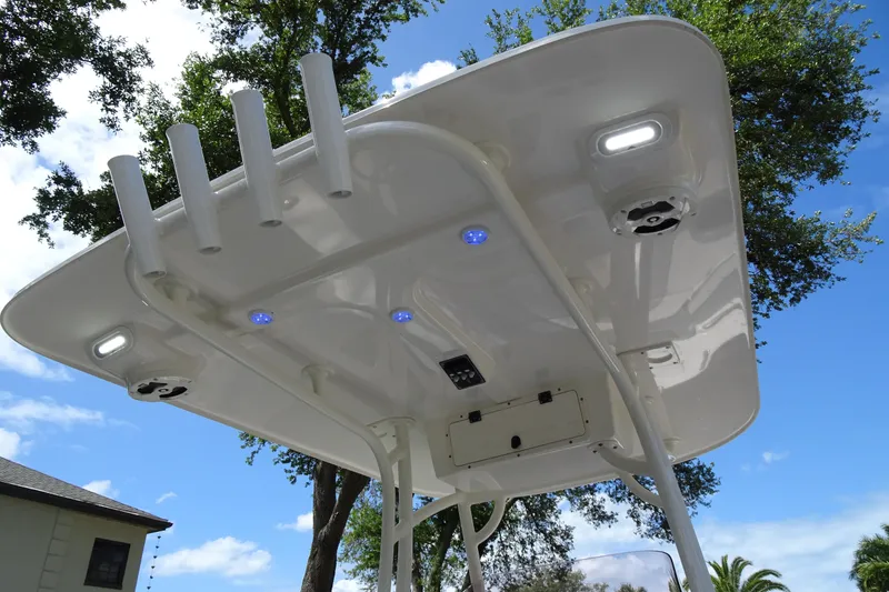 Slide: The Image of 2022 NauticStar 2302 Legacy boat canopy with rod holders and LED lights. - 21