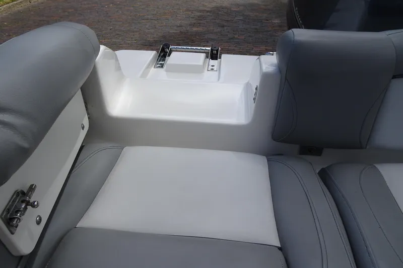 Slide: The Image of Interior seating of 2022 NauticStar 2302 Legacy boat, featuring gray and white upholstery. - 22