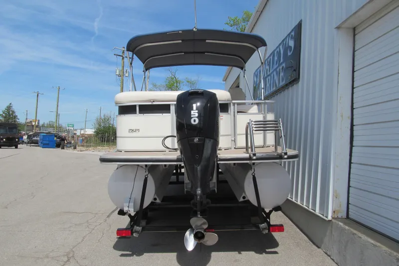 Slide: The Image of 2008 Sun Tracker Party Barge 25 Regency Edition with 150 HP engine, parked outside. - 4