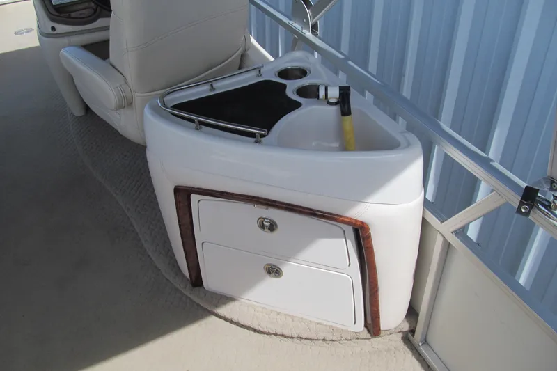 Slide: The Image of 2008 Sun Tracker Party Barge 25 Regency Edition interior with sink and storage drawers. - 6