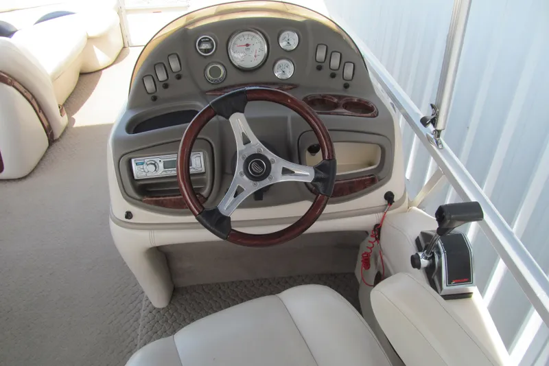 Slide: The Image of 2008 Sun Tracker Party Barge 25 Regency Edition helm with steering wheel and control panel. - 7