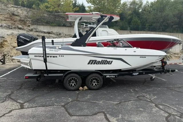 Slide: The Image of 2021 Malibu Wakesetter 21 VLX boat on trailer in parking lot. - 12
