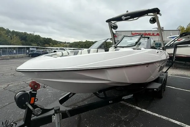 Slide: The Image of 2021 Malibu Wakesetter 21 VLX boat on trailer in parking lot. - 13