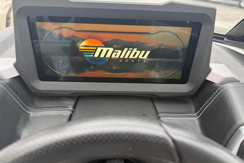 Slide: The Image of Dashboard display of 2021 Malibu Wakesetter 21 VLX boat with logo and slogan. - 22