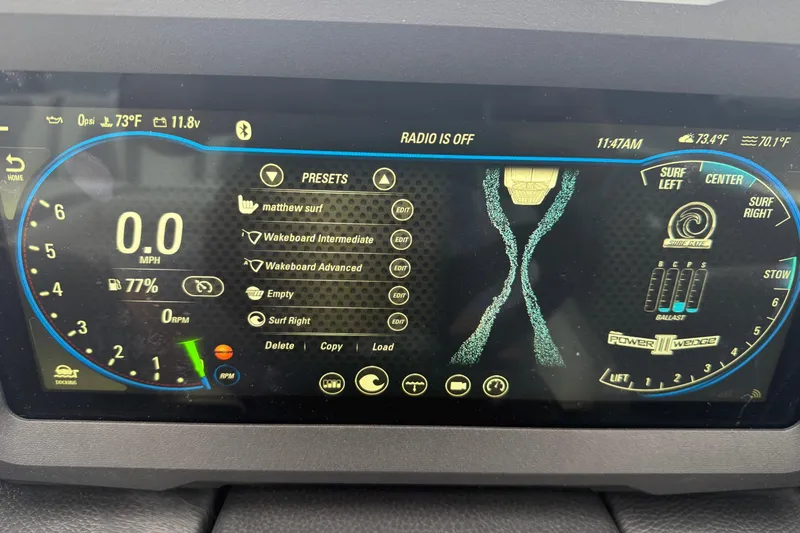 Slide: The Image of 2021 Malibu Wakesetter 21 VLX dashboard display showing speed, presets, and surf settings. - 26