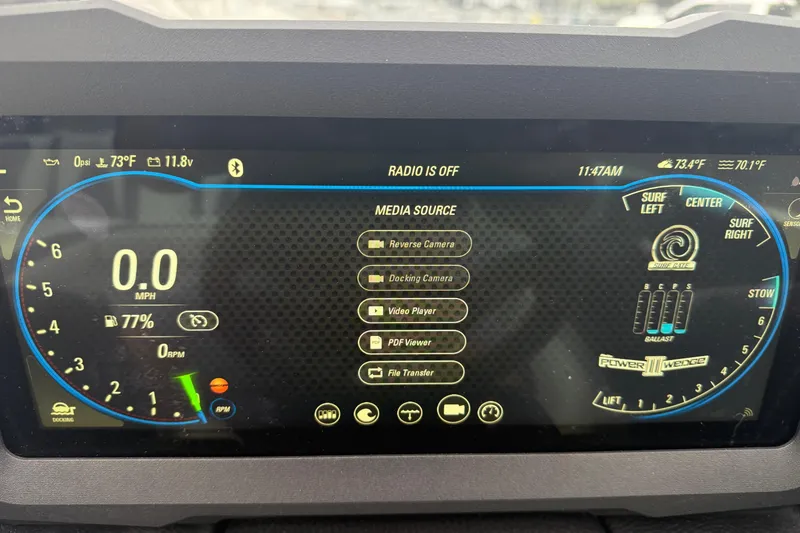 Slide: The Image of 2021 Malibu Wakesetter 21 VLX dashboard display showing speed, media options, and surf settings. - 27