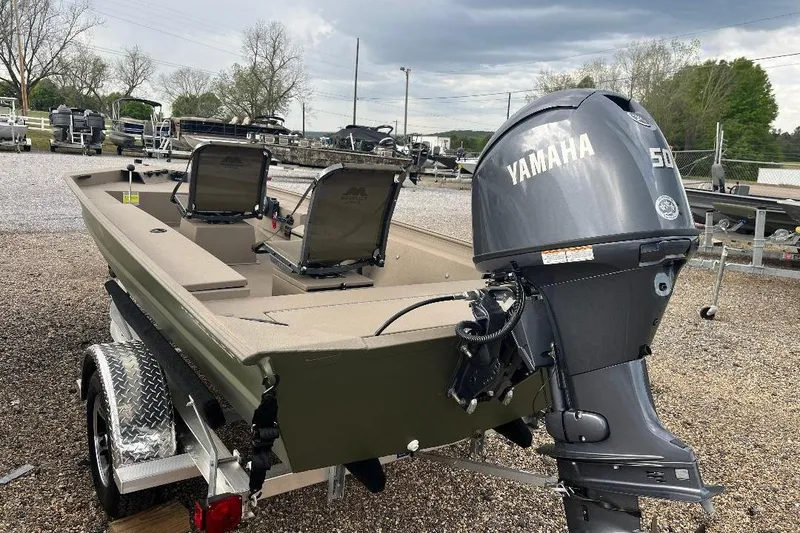 Slide: The Image of 2026 Alweld 1652VSTK boat with Yamaha 50HP engine on trailer, parked outdoors. - 10