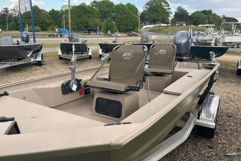 Slide: The Image of 2026 Alweld 1652VSTK boat on trailer, featuring dual seats and outboard motor. - 5