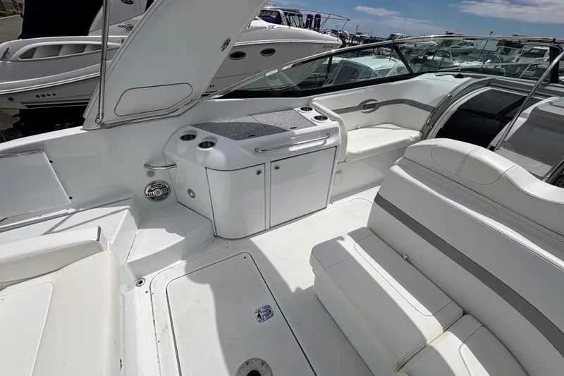 Slide: The Image of 2008 Formula 310 Sun Sport boat interior with white seating and sleek design. - 10